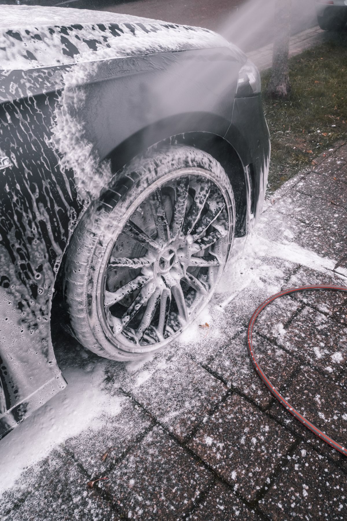 Pro Vets Pressure Washing technician cleaning a residential driveway in St. Johns, Florida